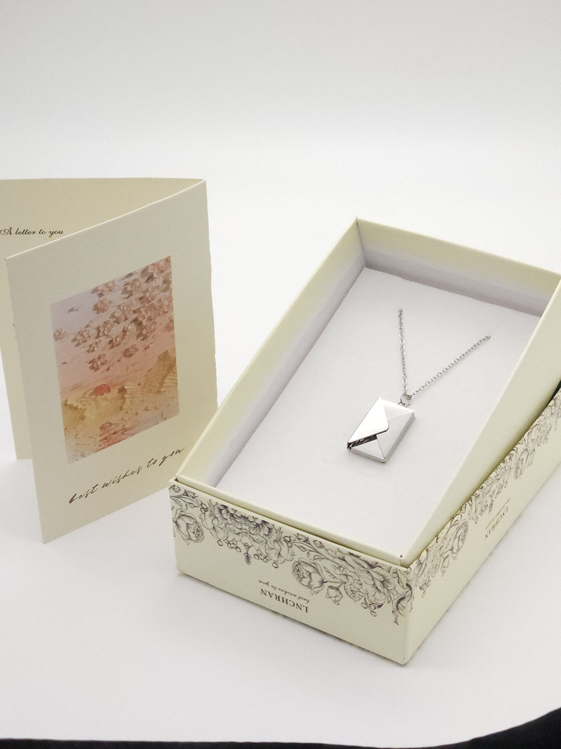 ziver of goudkleurige boekjesketting met persoonlijke brief – rvs